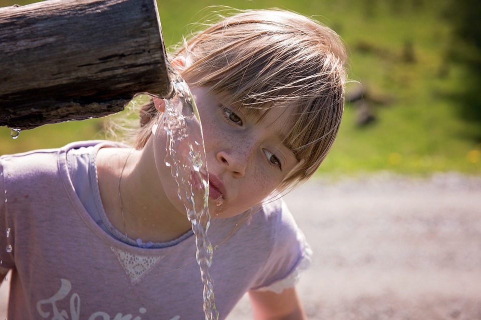 child at fountain